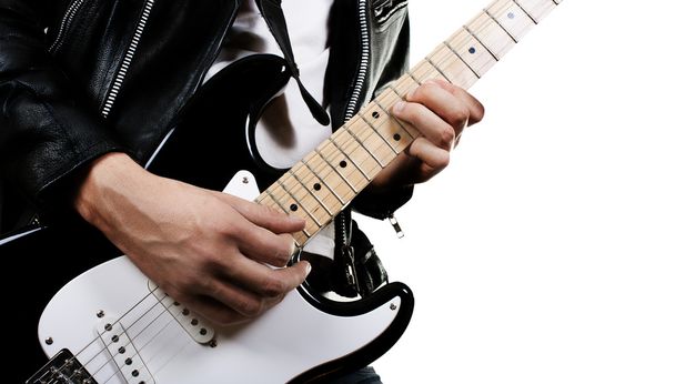 Guitarist playing on electric guitar - Fotó, kép