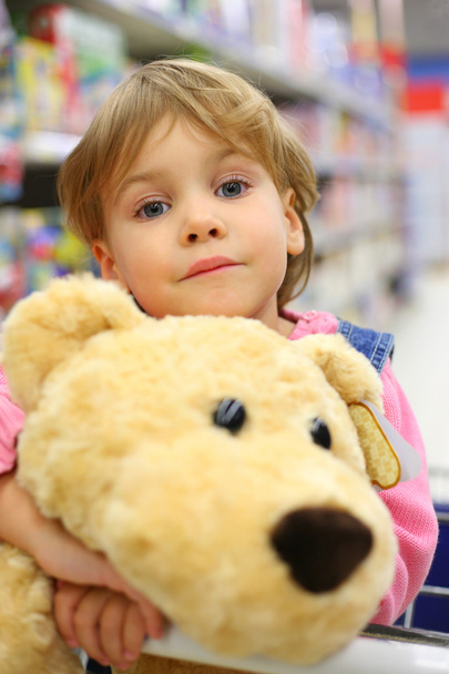 Girl with soft toy in shop - Foto, Imagen