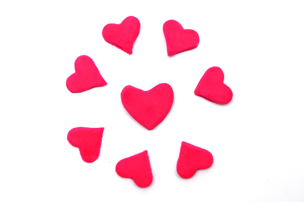 Pintado corazones rosados de plastilina en el fondo
 - Foto, imagen