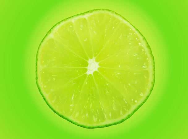 Lime slice on green - Foto, Bild
