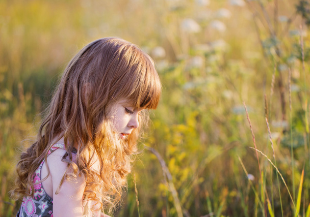 little girl with flowers outdoor - Photo, image