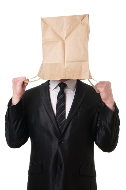 biznesmen ciągnięcie papierową torbę na głowę - Zdjęcie, obraz