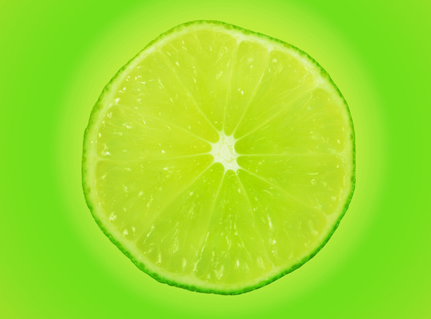 Lime slice on green - Photo, Image