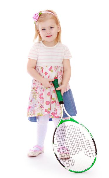 Caucasian little girl with a big tennis racket - Фото, изображение