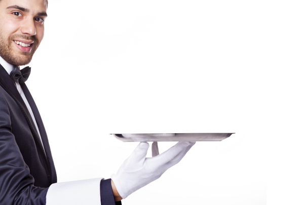 waiter holding an empty silver tray - Φωτογραφία, εικόνα