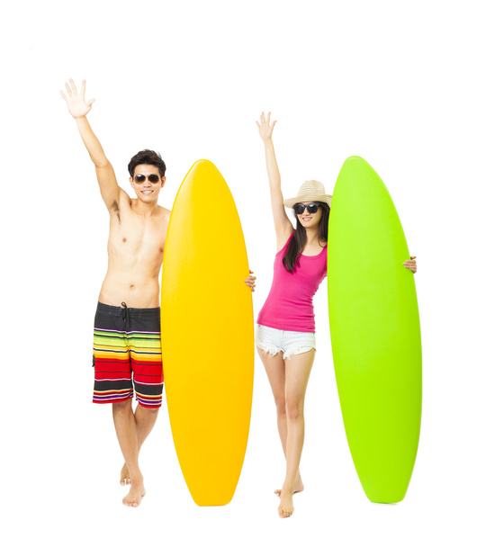  jovem surfista casal com prancha
 - Foto, Imagem