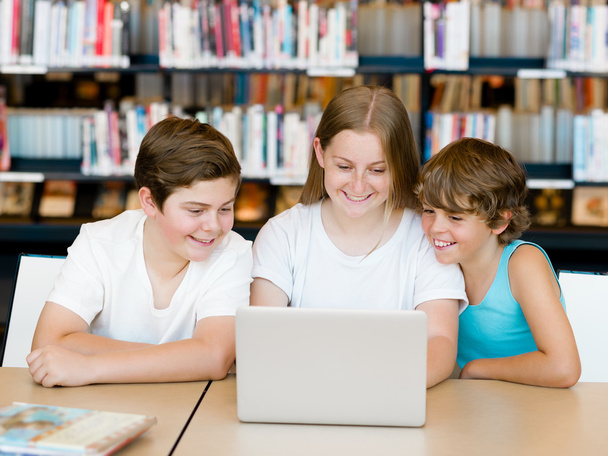 Three kids in library - Photo, Image