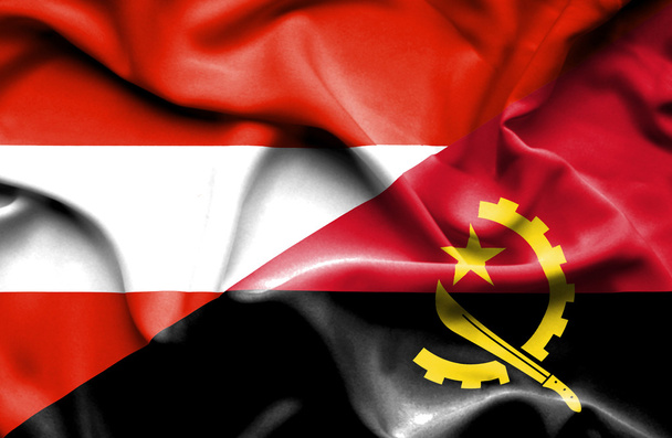Waving flag of Angola and Austria  - Valokuva, kuva