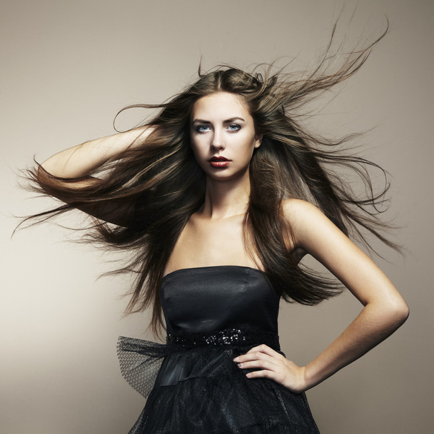 Portrait of young dancing woman with long flowing hair - Фото, зображення