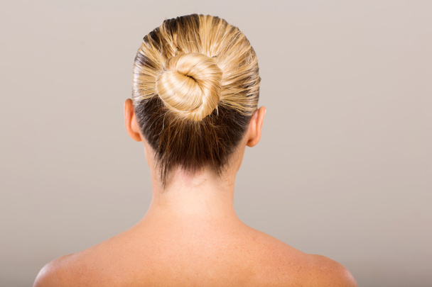woman with hair bun - Фото, зображення