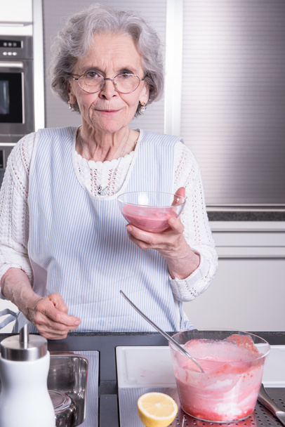 active female  senior in kitchen - Photo, image