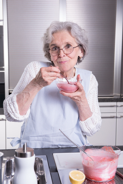 active female  senior in kitchen - Photo, image