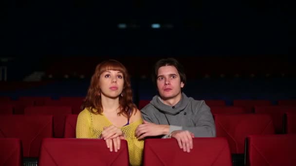 Young man with woman watch movie - Footage, Video