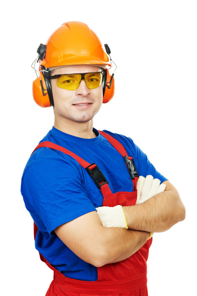 Builder in hard hat, earmuffs and goggles - Foto, Imagem