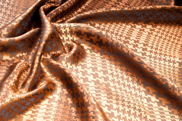 A textura do tecido de seda, pintado com um padrão marrom. textura macro de estúdio tecido listrado marrom. Textura de tecido artístico, dobrado, ondulado
.  - Foto, Imagem