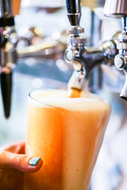 Bartender pouring draft beer - Photo, Image