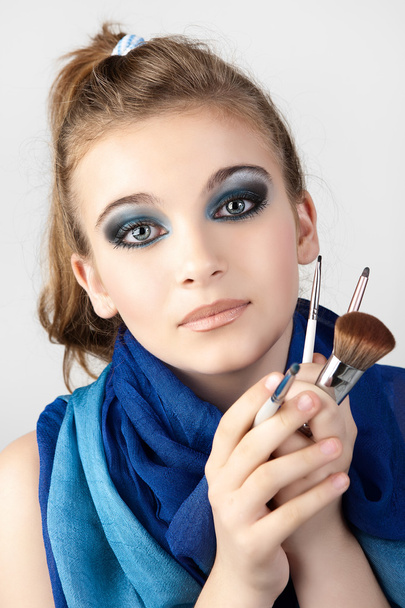 woman with make-up brushes - Fotó, kép