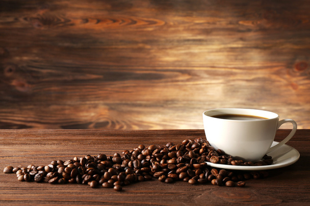 Cup of coffee with grains - 写真・画像