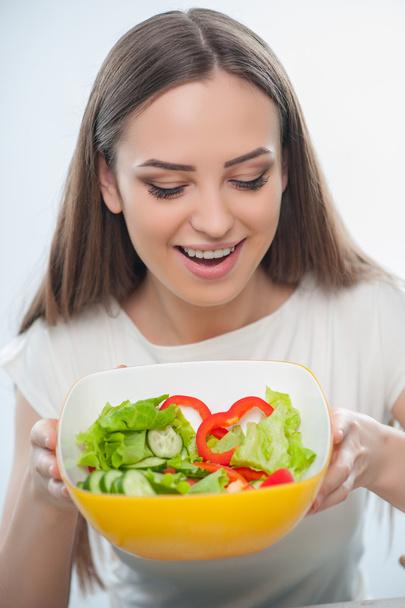 Pretty young woman is preparing to eat healthy food - Fotó, kép