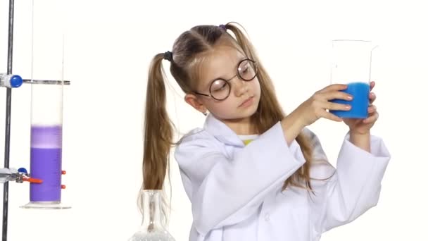 girl evaluates chemical experiment - Video