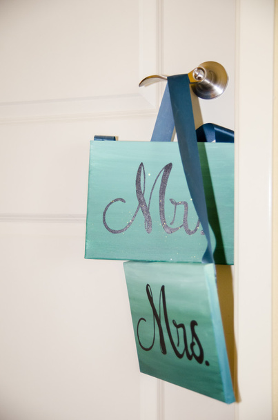 Words ''Mr. and Mrs'' on square plaques hanging on door - Photo, Image