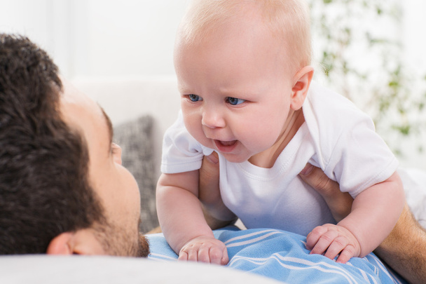 father playing with a baby - Fotoğraf, Görsel