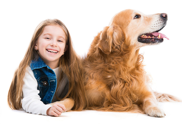 Happy little girl with retriever  dog - Фото, изображение