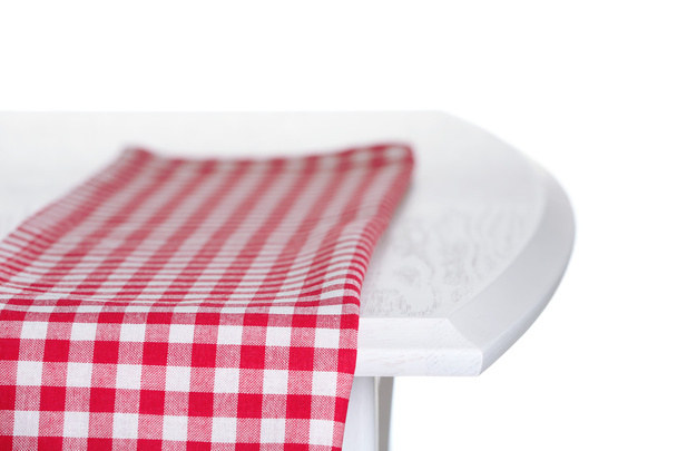 Wooden table with napkin isolated on white - Φωτογραφία, εικόνα