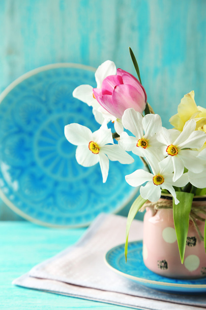 Spring bouquet in vase on color wooden background - 写真・画像