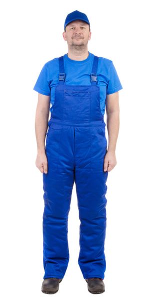 Man in blue overalls. - Фото, зображення