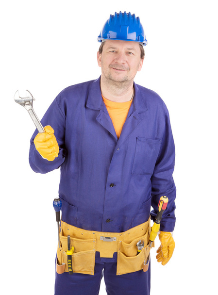 Worker in hard hat holding wrench. - Foto, imagen