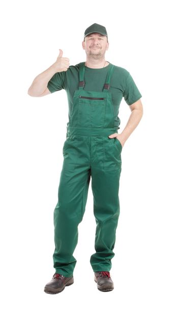 Worker in green overalls. - Foto, Bild