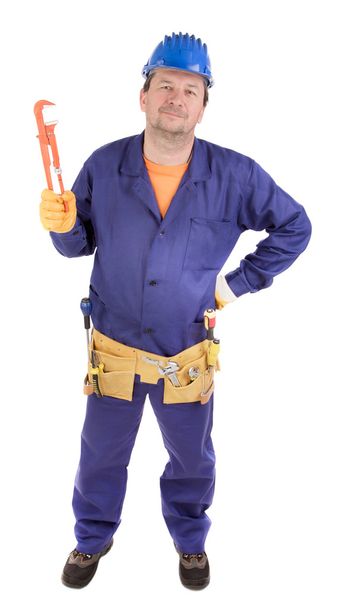 Worker holding gas wrench. - Zdjęcie, obraz