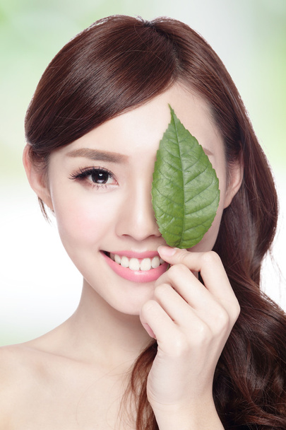 woman face portrait with green leaf - Fotó, kép