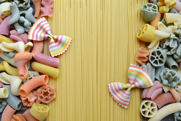 Set of different kinds of colorful Italian pasta on wooden table - Photo, Image