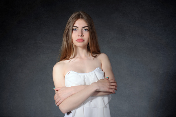 Uncertainty, timidity, secrecy concept. Woman crossed her arms  - Фото, зображення