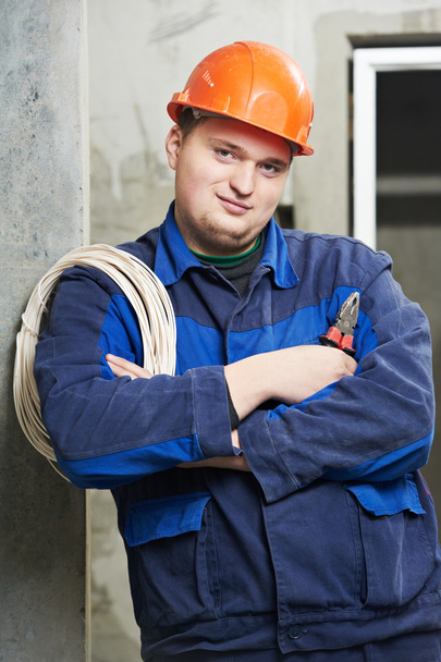Portrait of young Electrician in uniform - Foto, Imagem