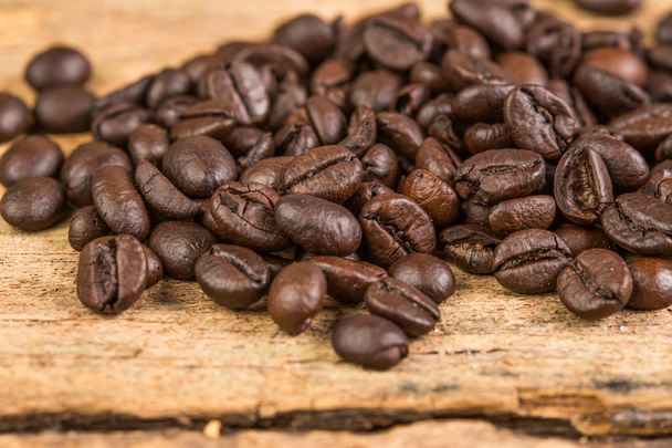 Coffee bean on grunge wooden background - Photo, Image