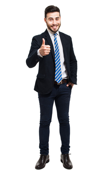 friendly businessman showing thumb up - Foto, afbeelding