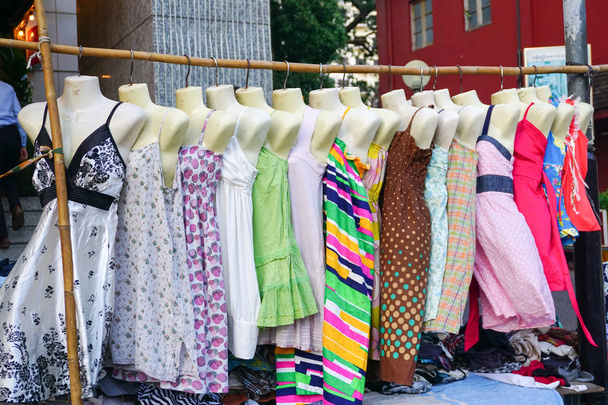 Woman dresses hanging on display at a flea market - Photo, Image