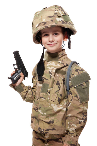 Young soldier with gun - Фото, изображение