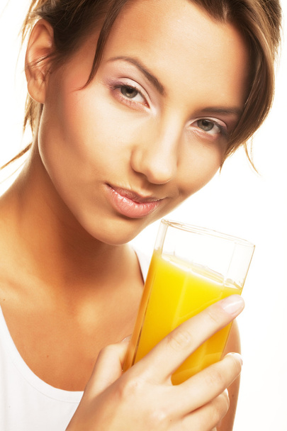 woman drinking orange juice close up - Fotoğraf, Görsel
