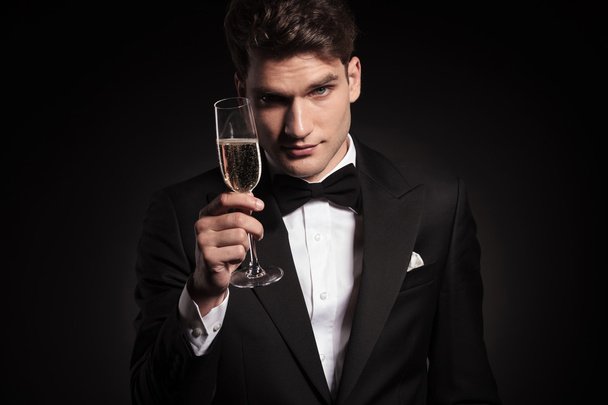  man offering you a glass of champagne. - Foto, Imagen
