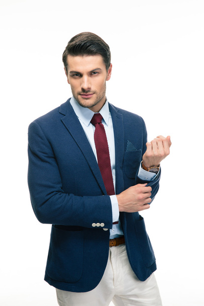 Happy handsome businessman buttoning jacket - Foto, immagini