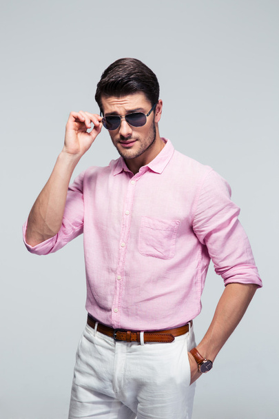 Portrait of a young handsome man in sunglasses - Foto, imagen