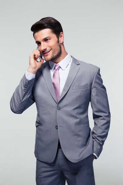 Happy businessman talking on the mobile phone - Photo, Image