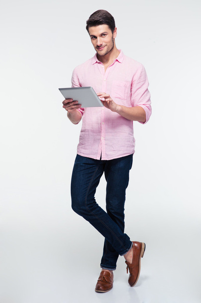 Young man using tablet computer - Photo, image