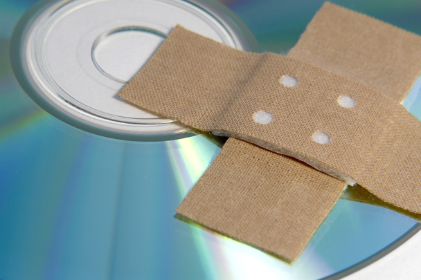 Adhesive plaster and CD ROM detail - Fotografie, Obrázek