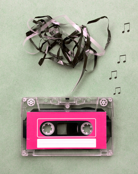 Vintage looking Magnetic tape cassette for audio music recording with song note blow out - Φωτογραφία, εικόνα