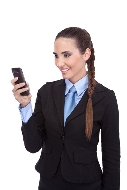Businesswoman reading text message on phone - Фото, зображення